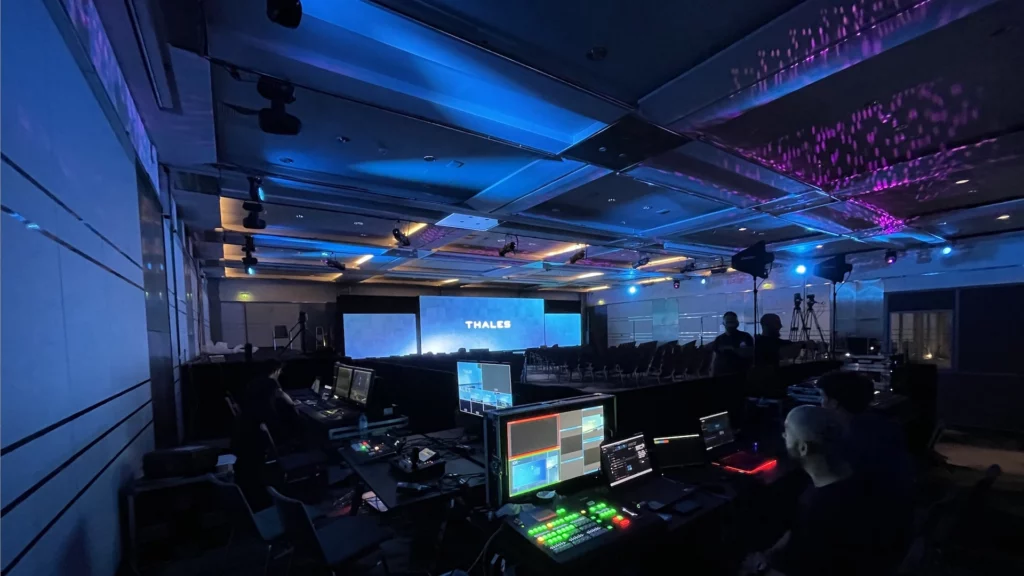 Conference stage with THALES screen and control booth