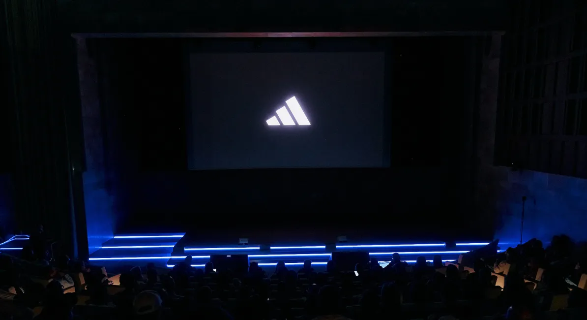 Adidas logo on large auditorium screen