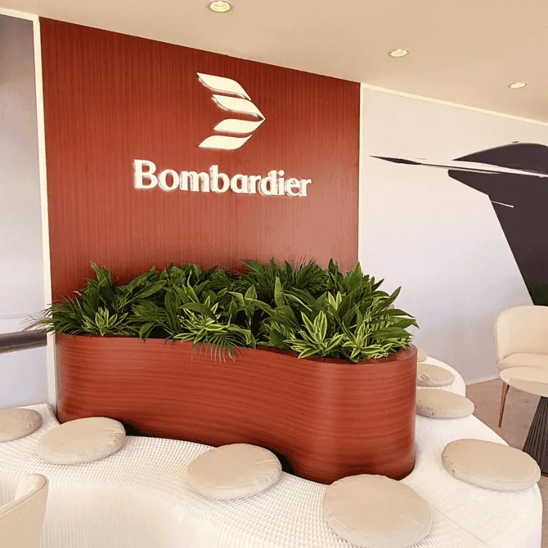 Bombardier logo on wood wall in modern lobby