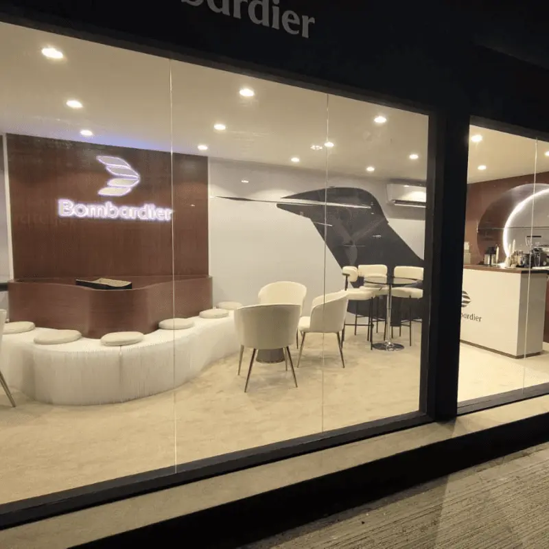 Modern Bombardier showroom interior with seating and logo