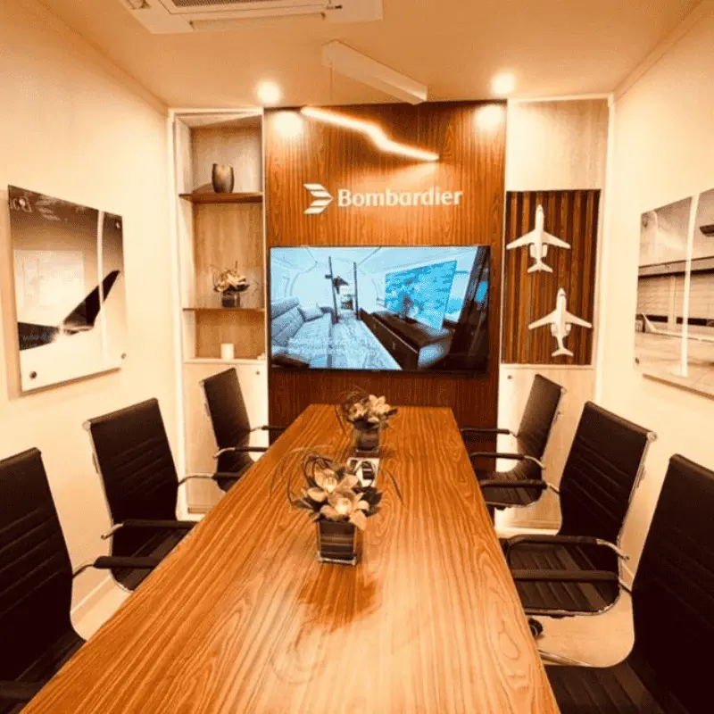 Bombardier conference room with wooden table and screen