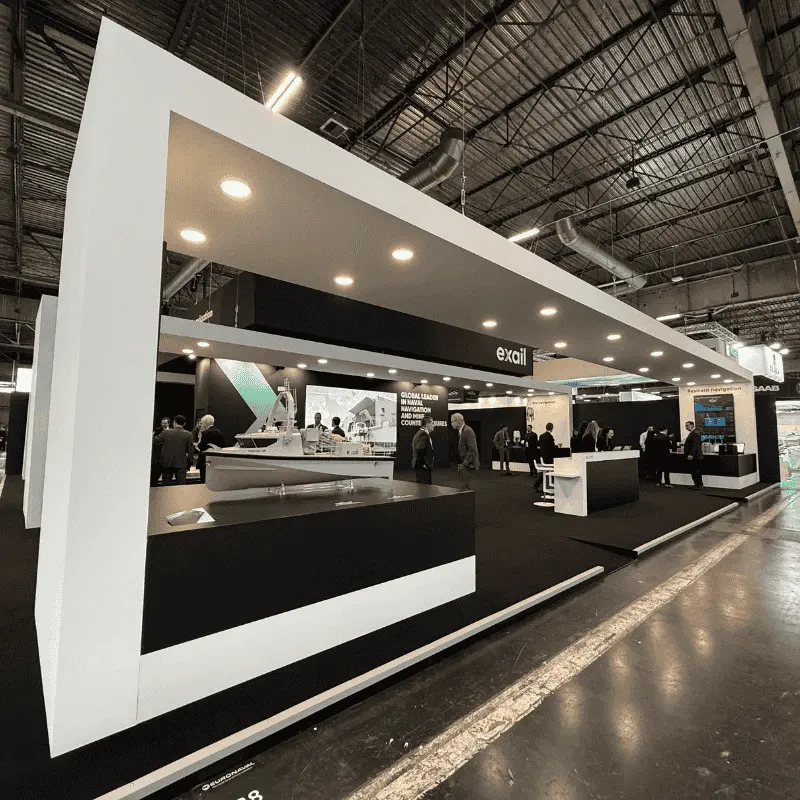 Modern trade show booth with boat model display