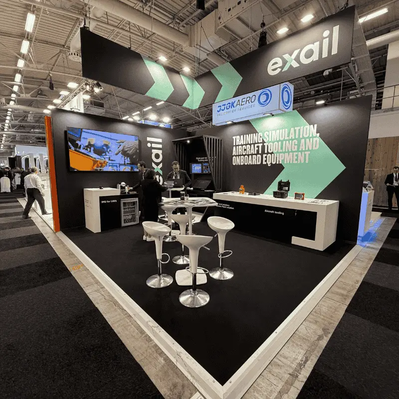 Exail trade show booth with aircraft simulation displays