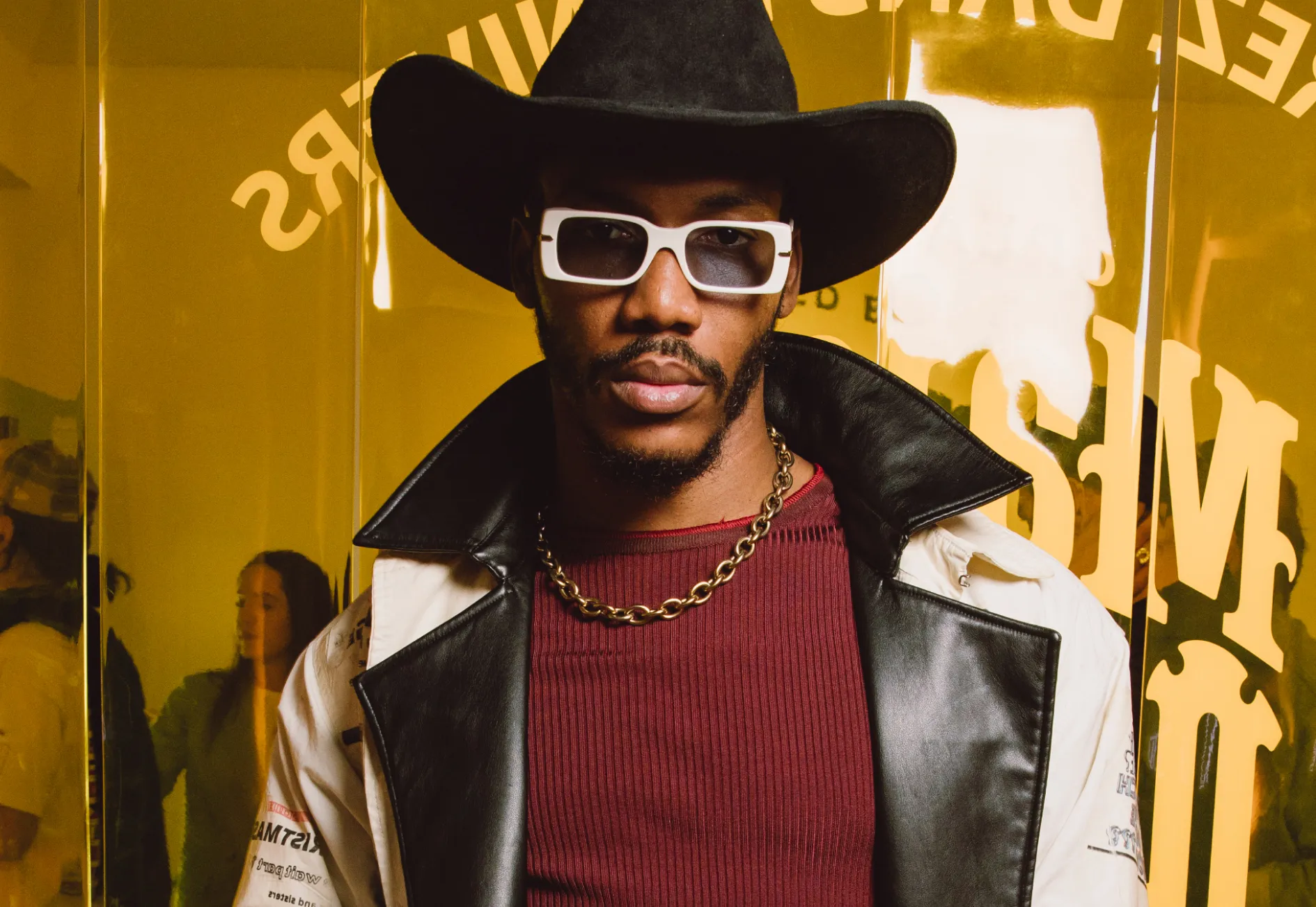 Stylish man in cowboy hat and sunglasses