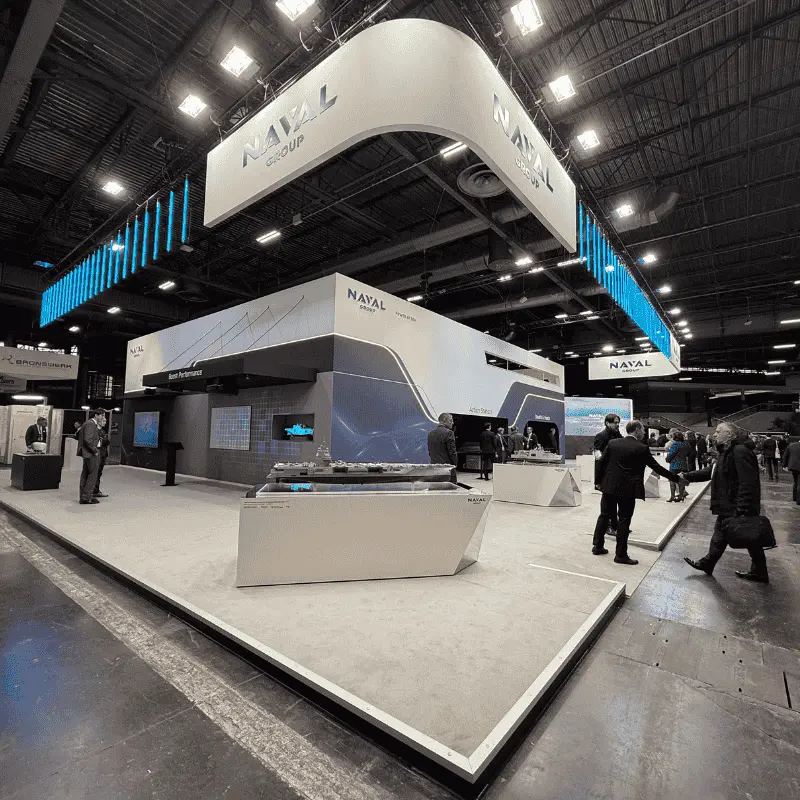 NAVAL Group trade show booth with ship models