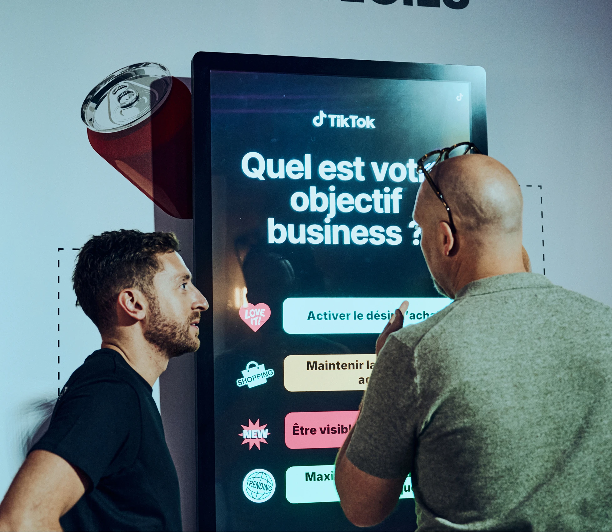 Two men viewing TikTok business objectives screen